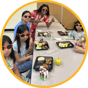 A family eating lunch at a summer meals site in Craven County.